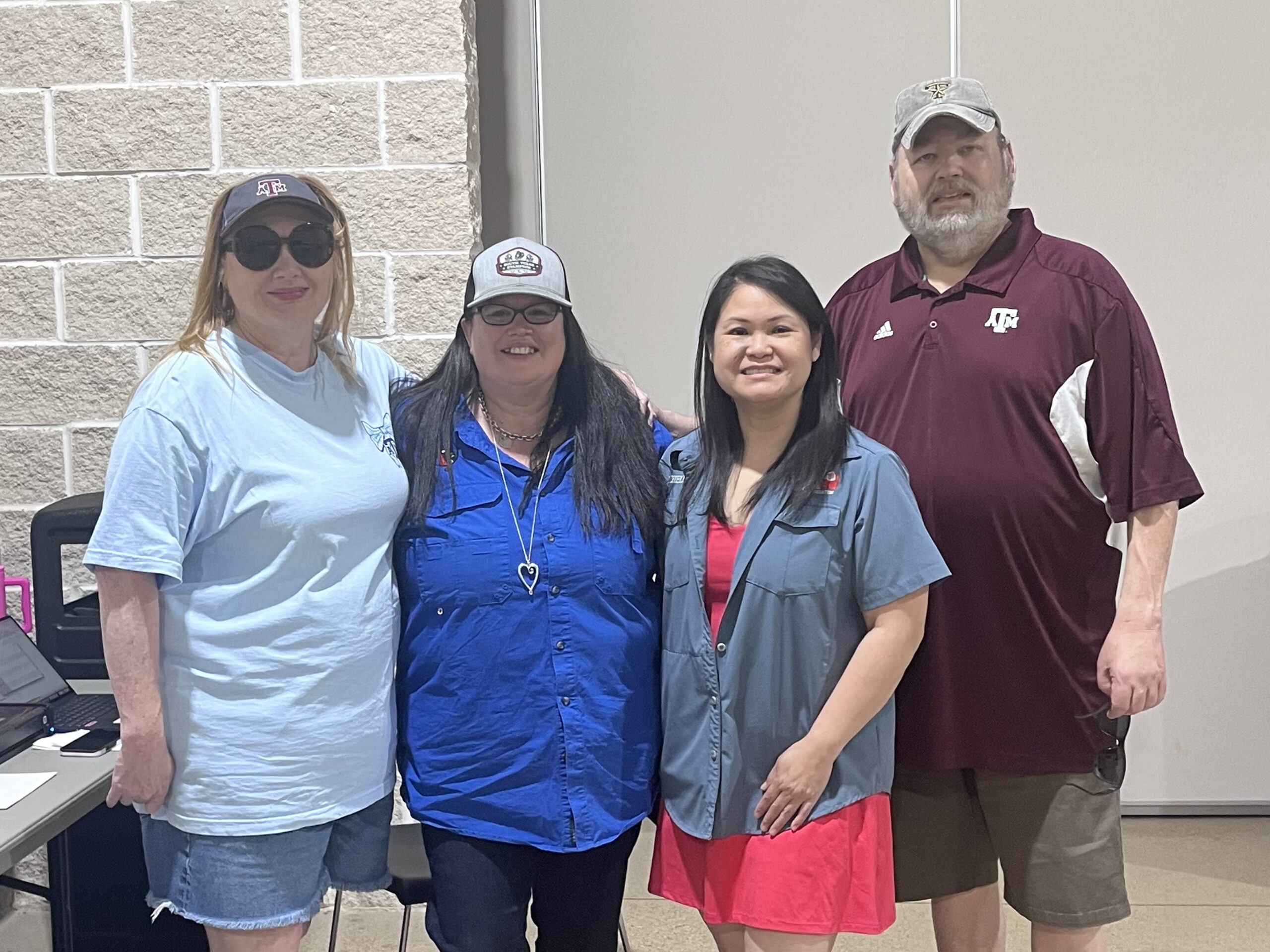 Four Gene Potts Memorial supporters and community partners posing together.