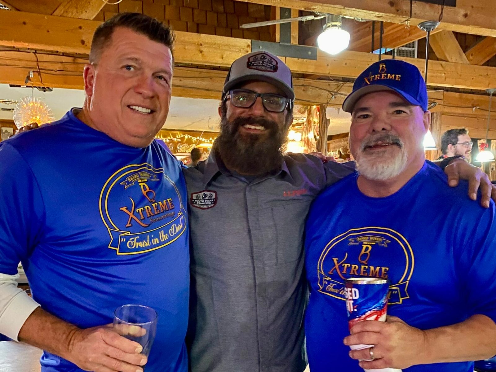 Three male cooks from South Texas Stampede and B Xtreme posing together at the Winter Wonderland Cookoff